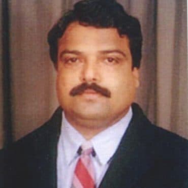 Portrait of SRI. R. V. SIRSALIMATH, Prof. Director at DHUSBN